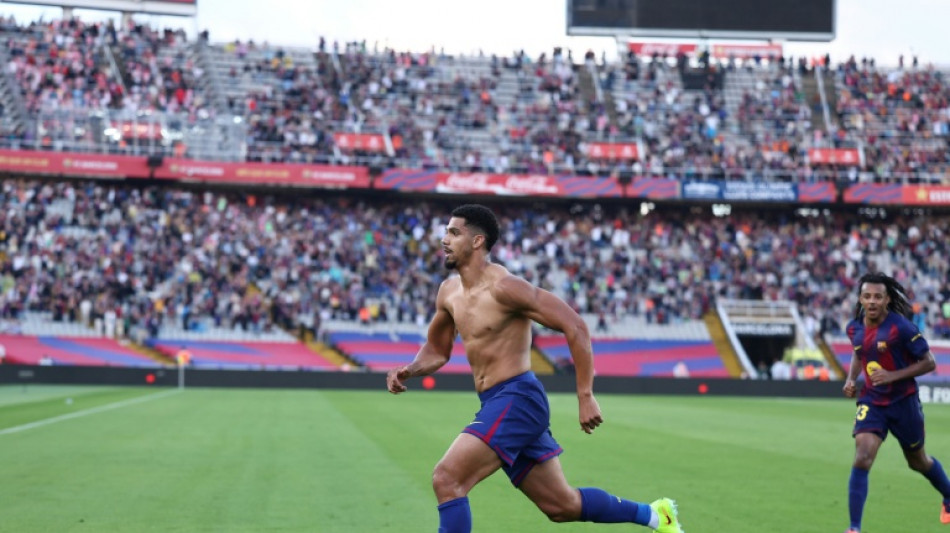 Araujo strikes late as Barca snatch win over Girona