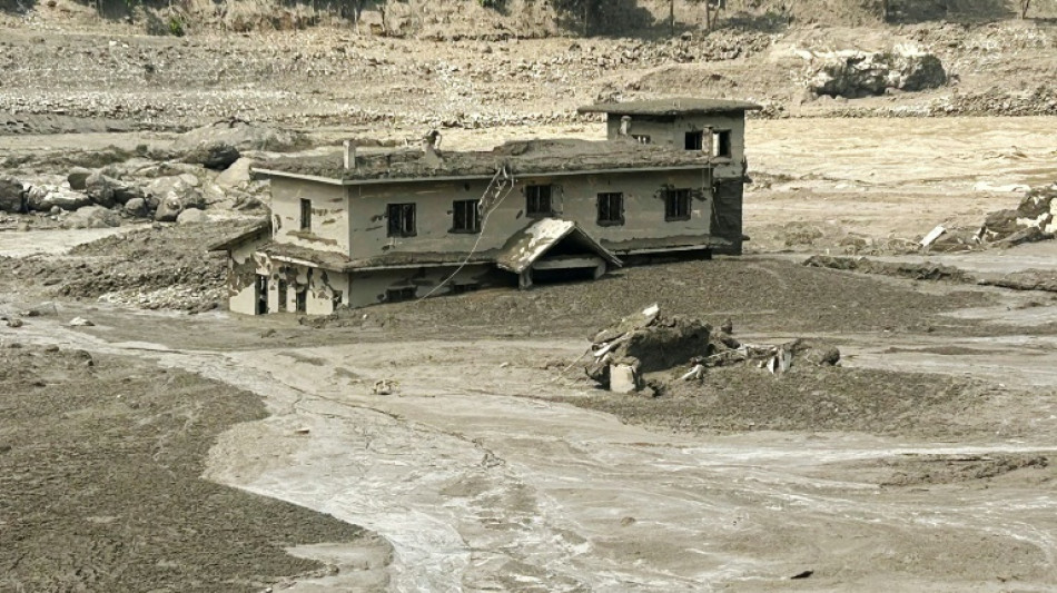 Hundreds missing after Nepal-Tibet flood kills 98