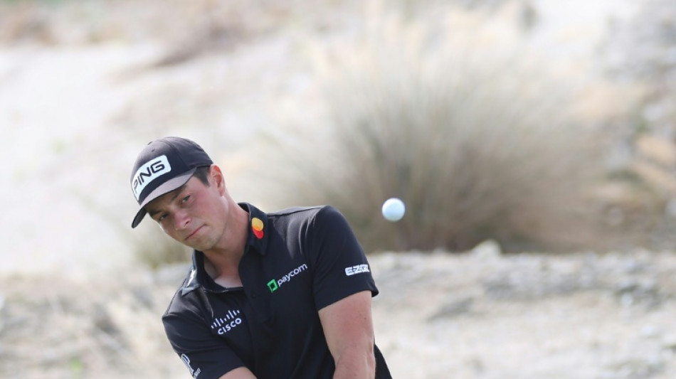 Defending champ Hovland leads wind-whipped Hero World Challenge